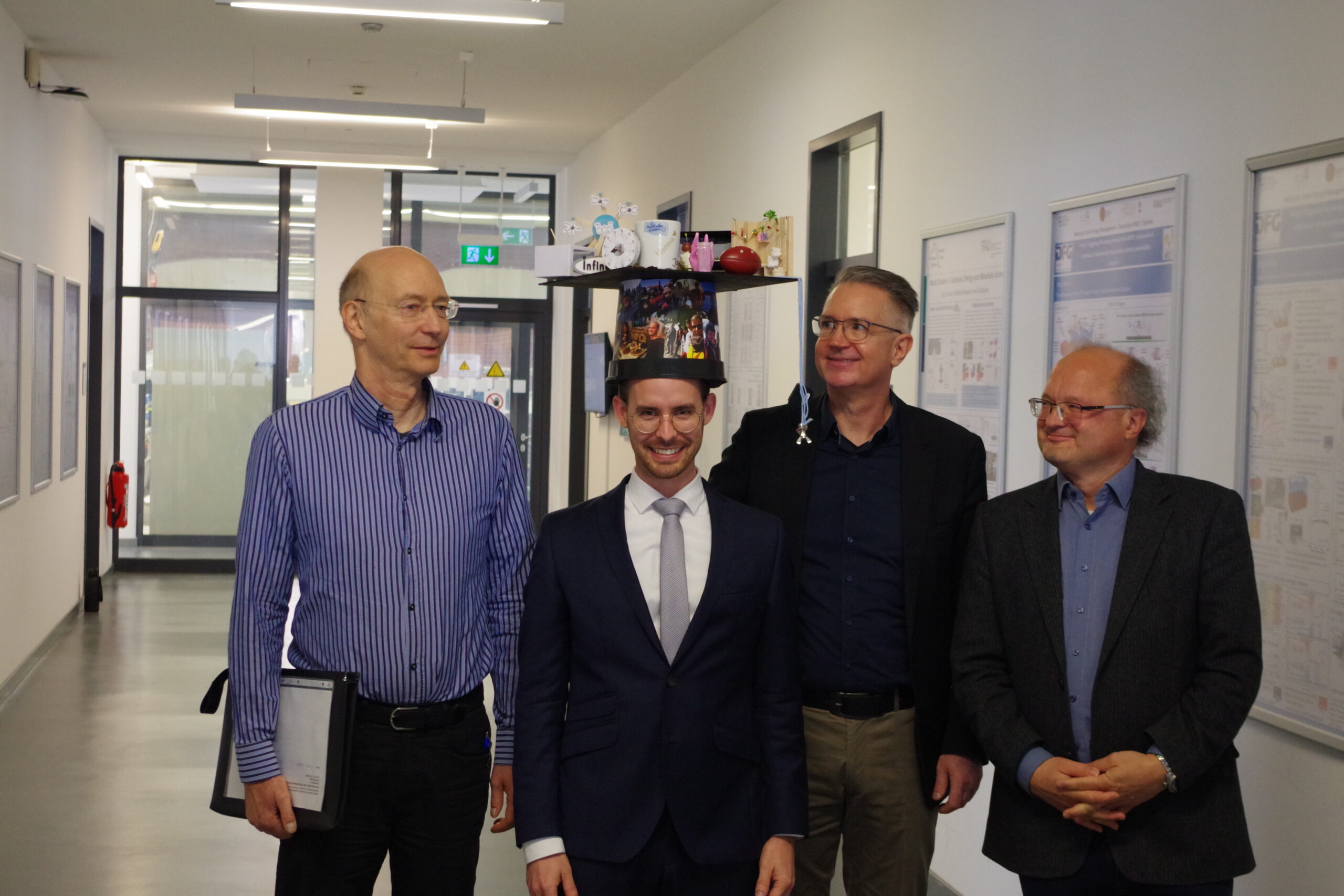 Dr. Simon Schötz 2025 and examiners.